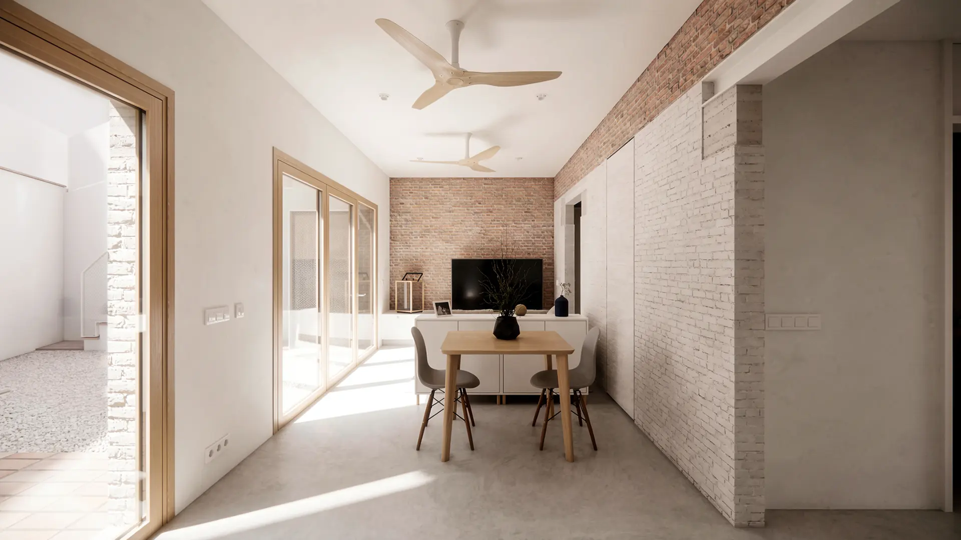 Salón comedor de vivienda reformada en Badalona, con suelo de microcemento, ladrillo antiguo recuperado visto, carpinterías de madera y doble apertura al patio interior. Proyecto de Tova Arquitectura