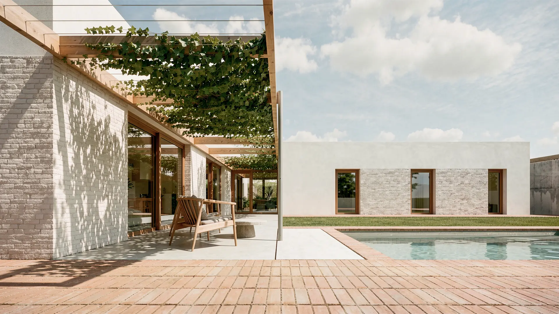 Terraza y piscina de vivienda unifamiliar de obra nueva en Cardedeu, con fachada de ladrillo visto blanco, carpinterías de madera y pérgola vegetal. Proyecto de Tova Arquitectura